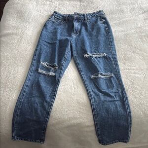 Women's distressed blue jeans